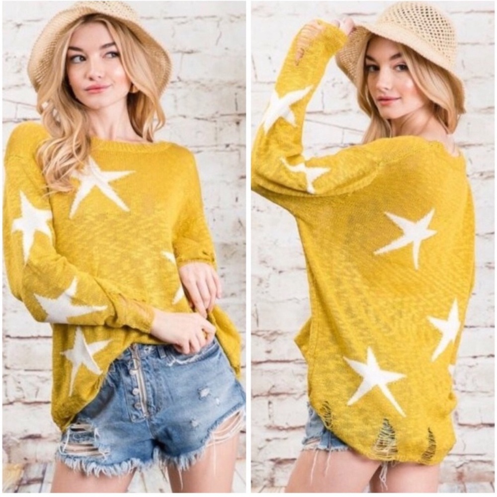 Star print distressed knit sweater